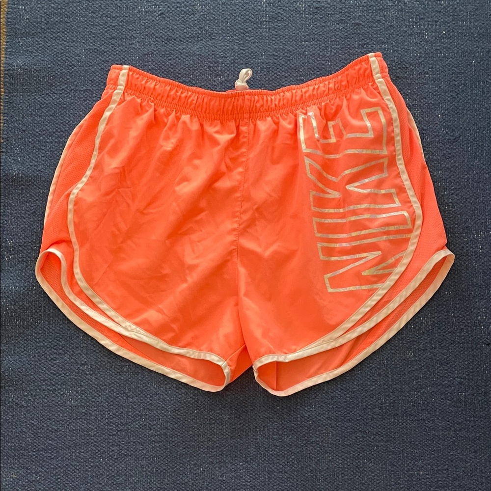 Nike Women’s Bright vibrant peach/pink Athletic Running Shorts with white Trim